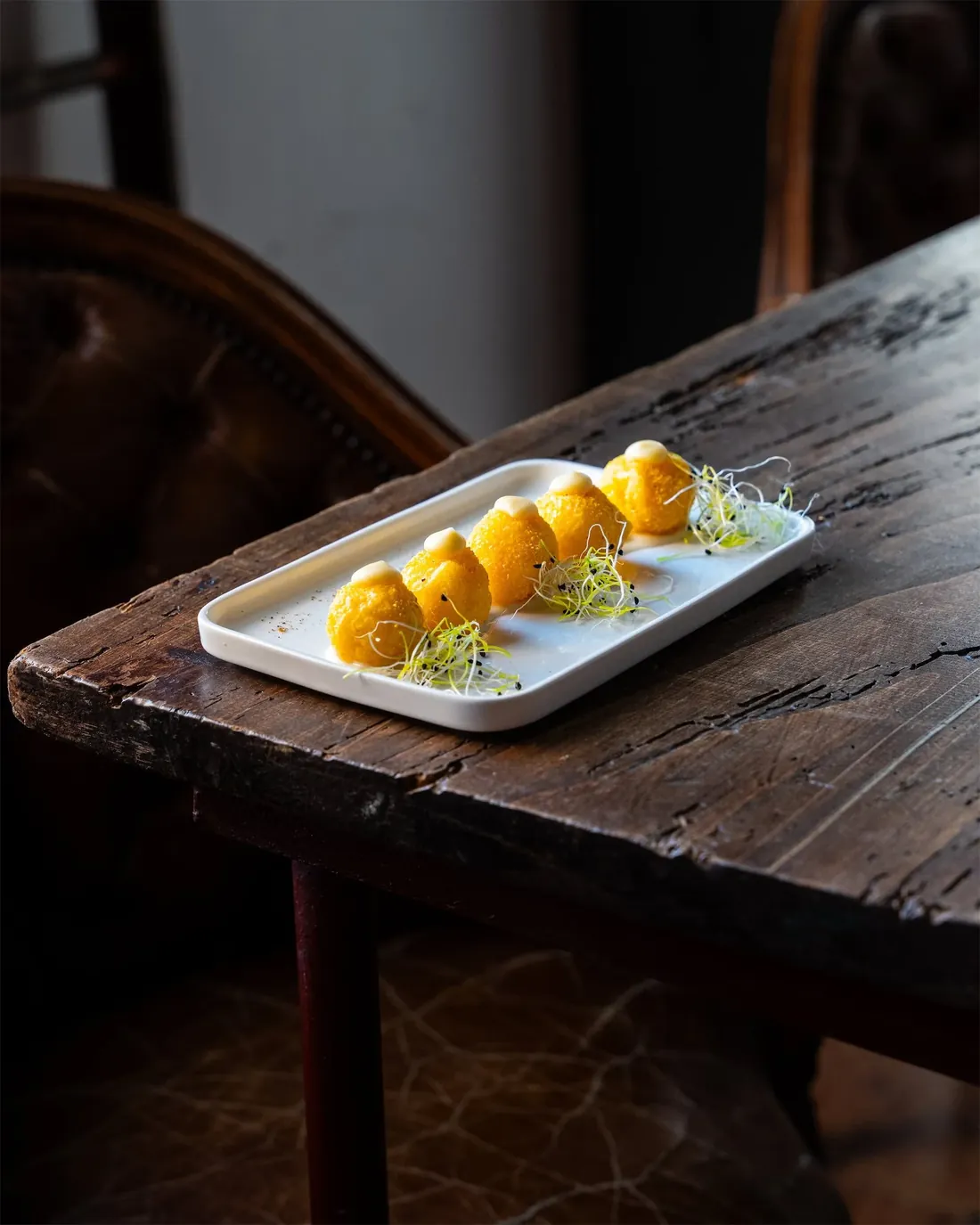 Ascolana olives on a white plate - i Fichi Secchi kitchen